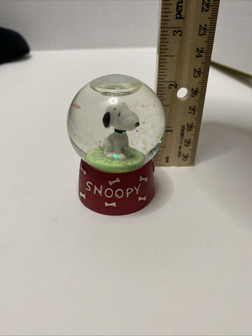SNOOPY SNOW GLOBE  UNIQUE  RED BASE "SNOOPY" WITH DOG BONES  