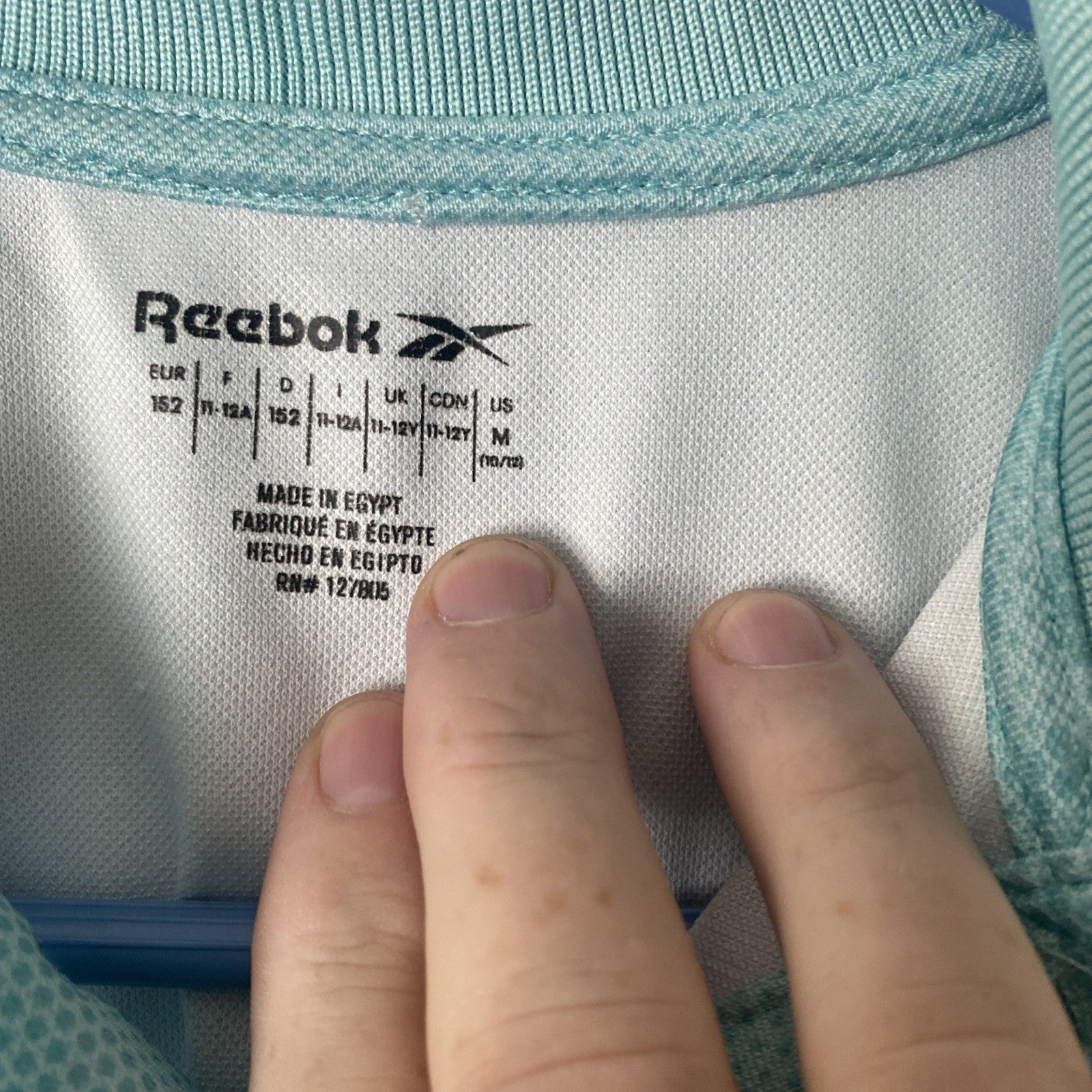 Reebok women’s size medium polo teal 1/4 button short sleeve