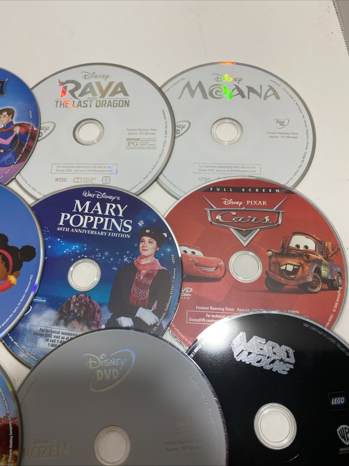 Lot of 20 Disney movie DVDs and sing-along CDs. Please See Photos