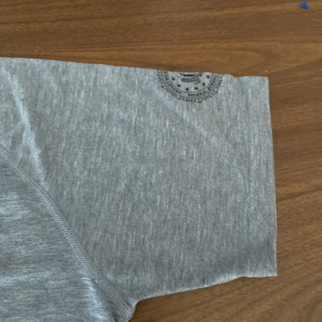 Under Armour small short sleeve shirt FBI logo left sleeve