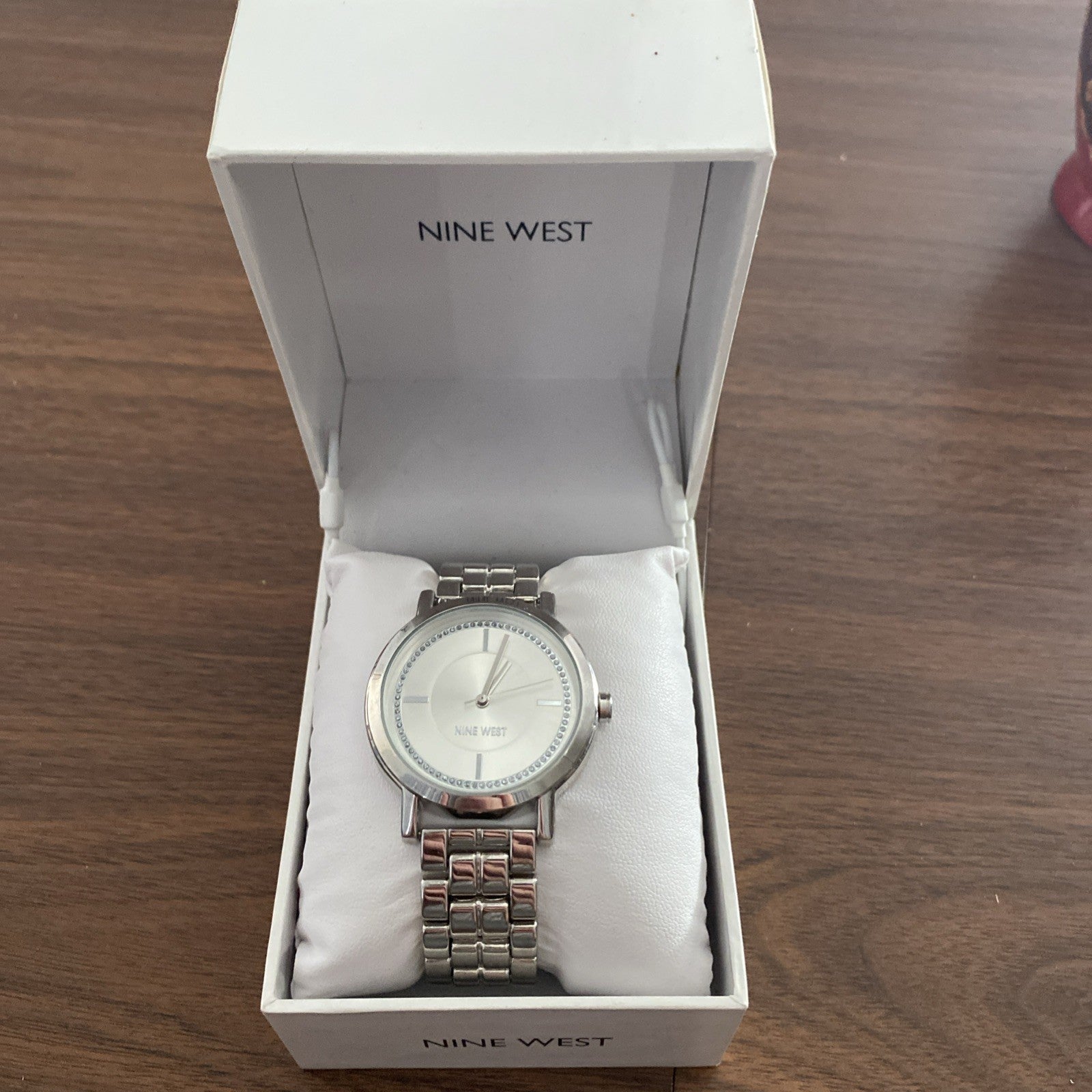 Men’s Nine West wristwatch still in box. Needs new battery.