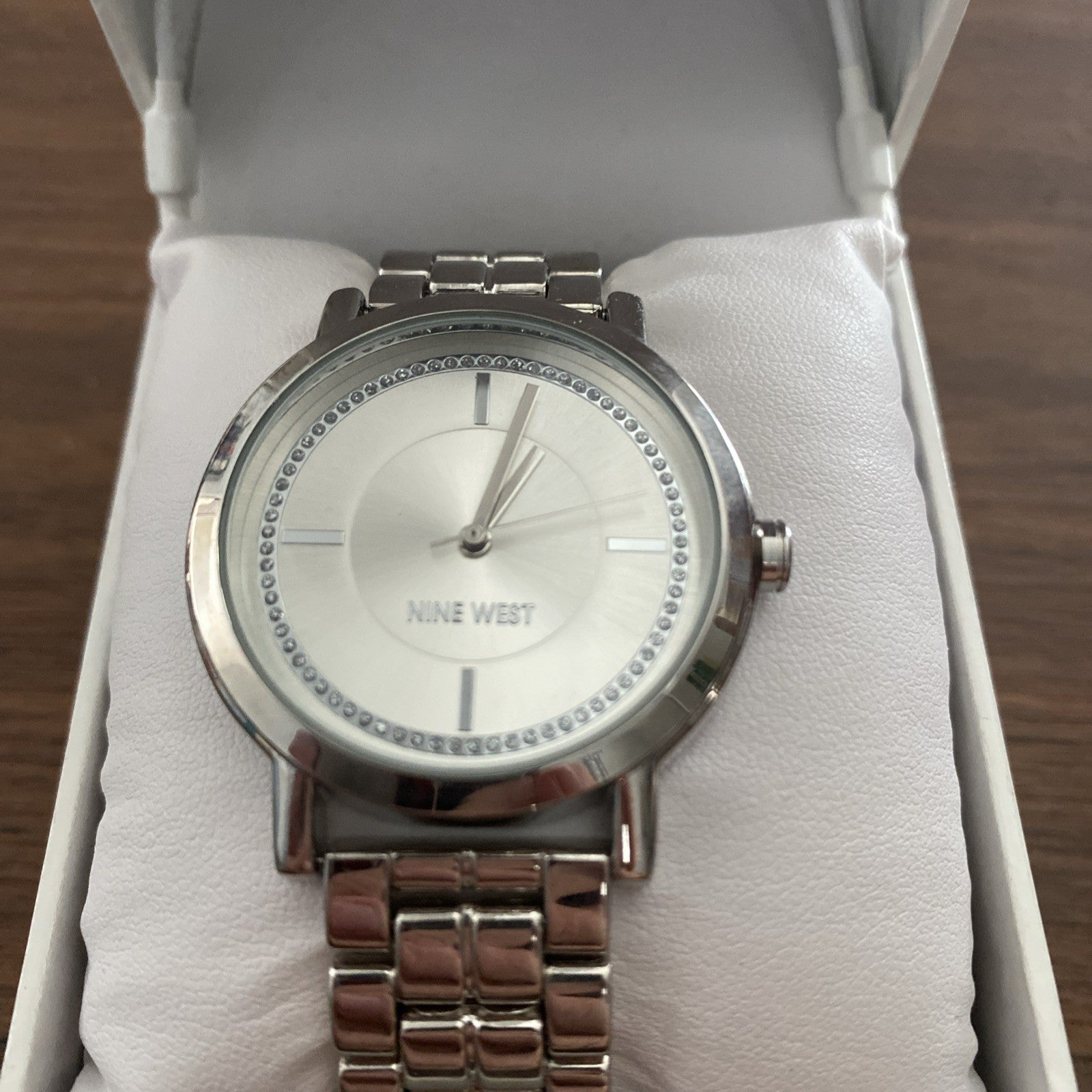 Men’s Nine West wristwatch still in box. Needs new battery.