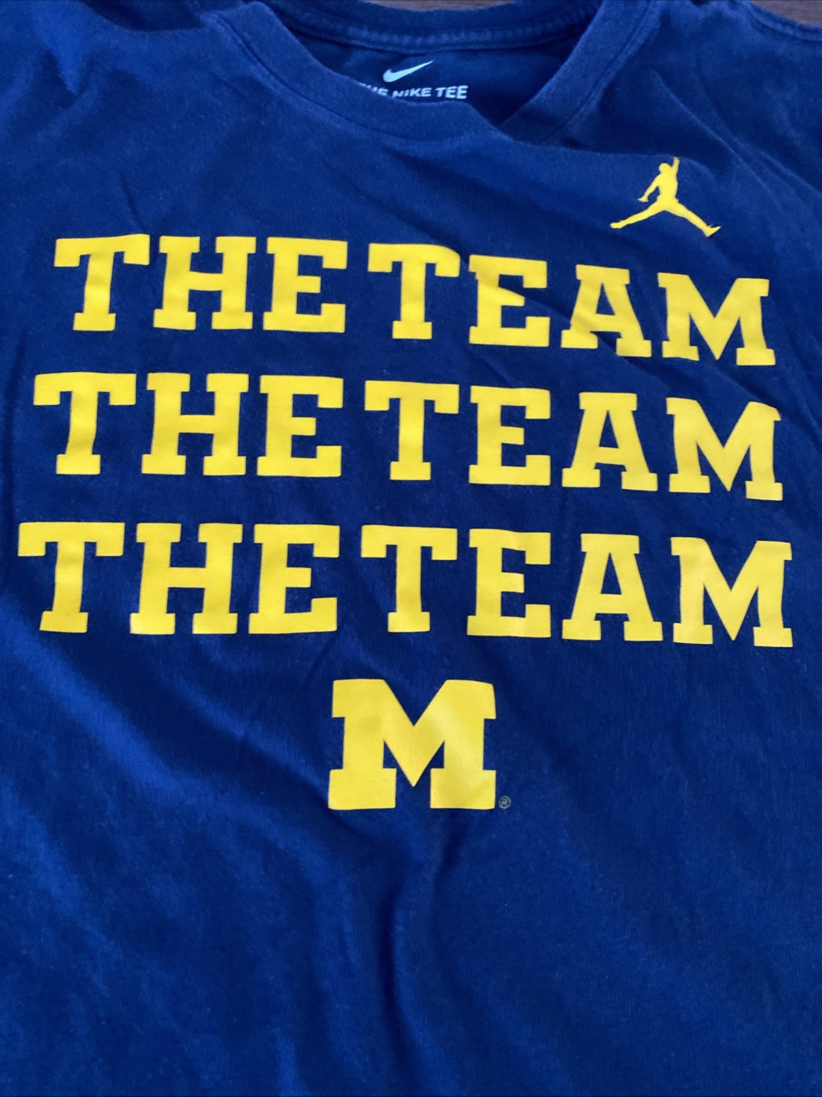 The Nike T extra-large Michigan the team the team the team