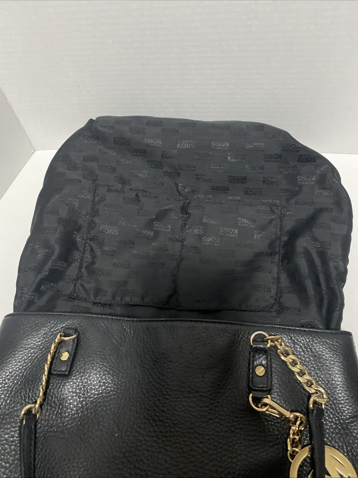 Michael Kors Black Pebbled Leather Handbag Purse Gold Medallion MK Chain EUC