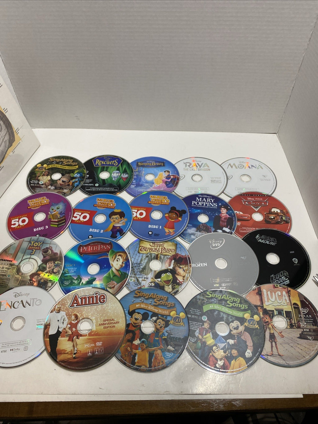 Lot of 20 Disney movie DVDs and sing-along CDs. Please See Photos