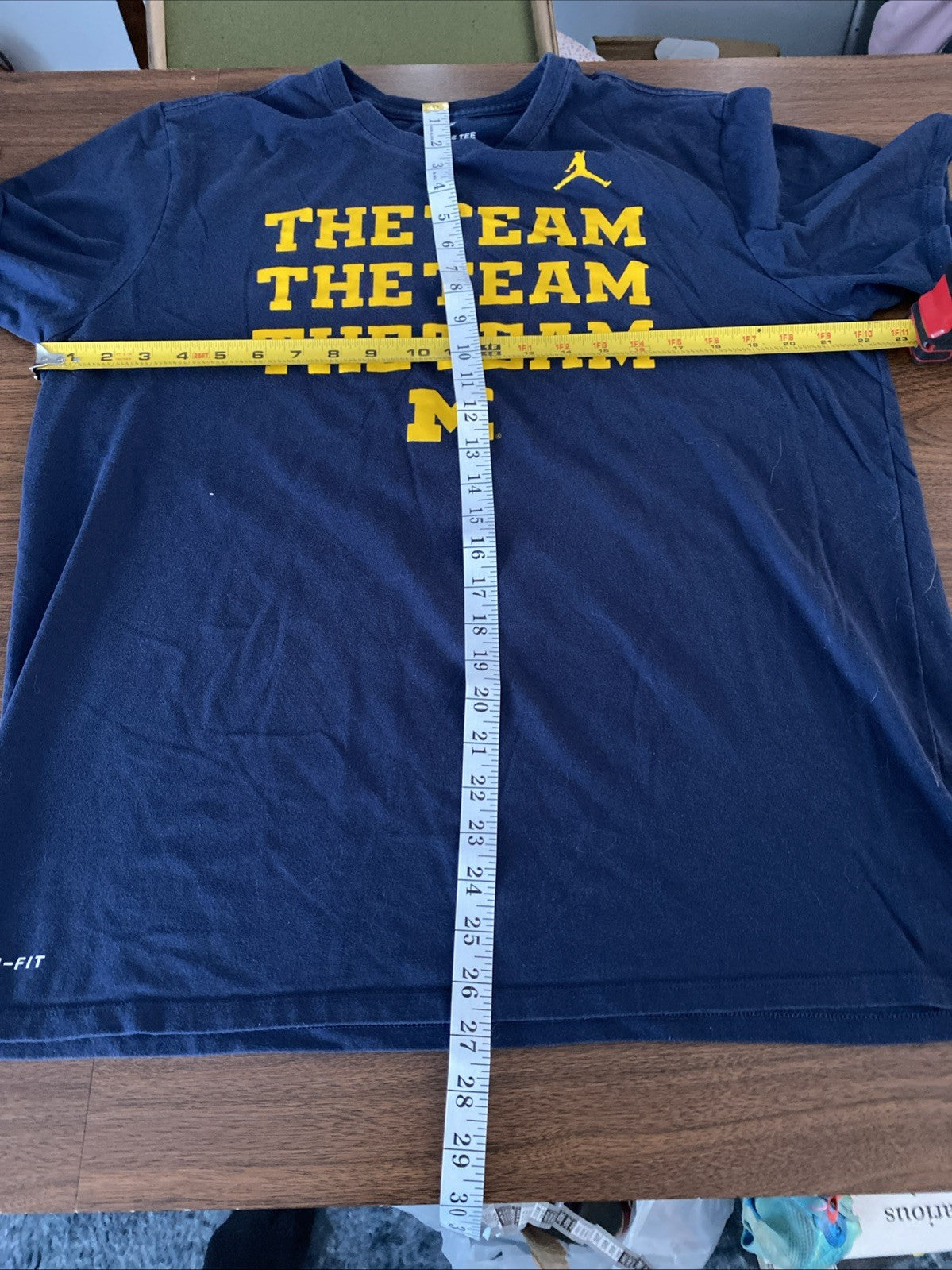 The Nike T extra-large Michigan the team the team the team