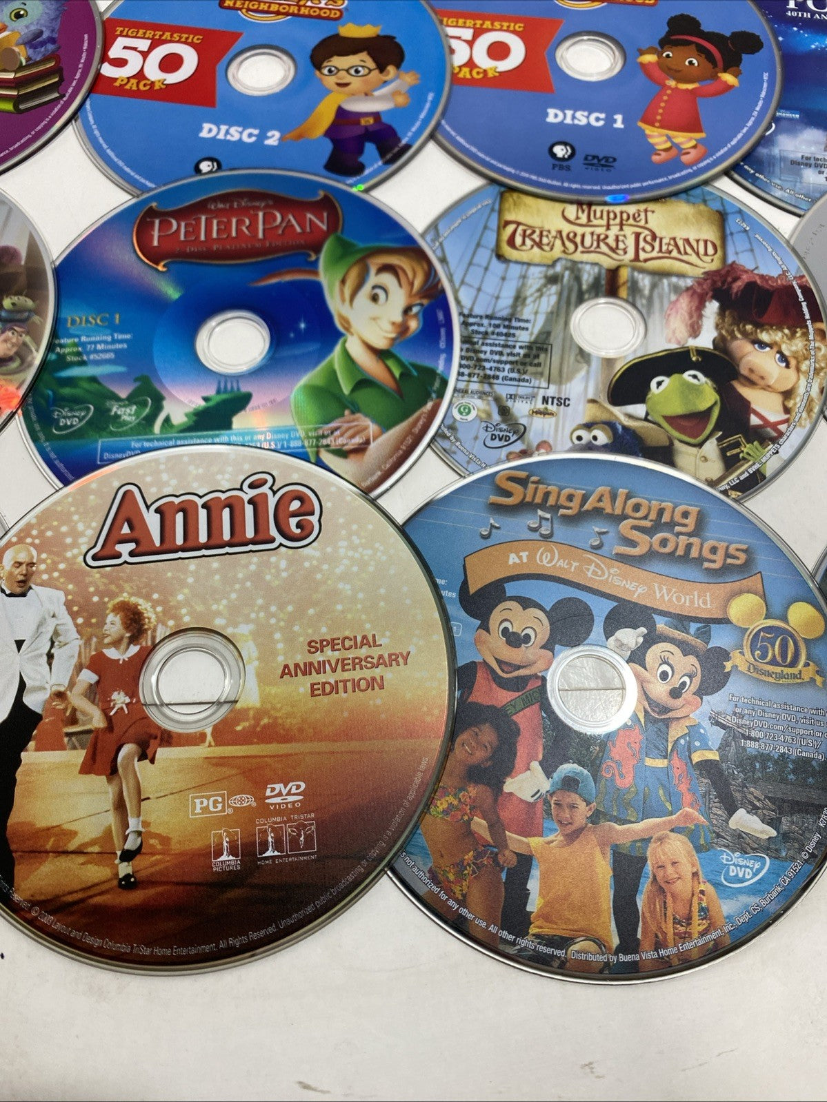 Lot of 20 Disney movie DVDs and sing-along CDs. Please See Photos