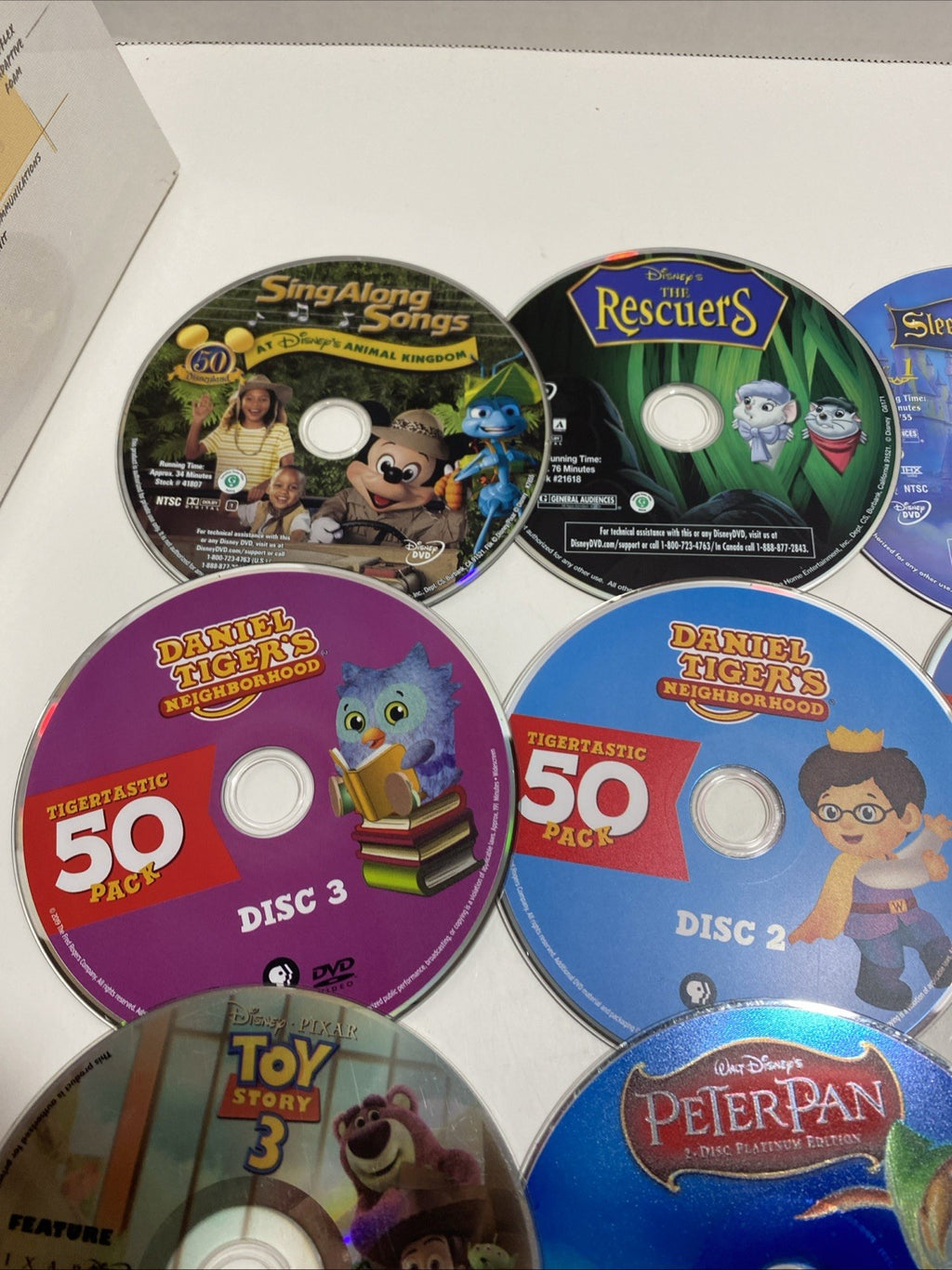 Lot of 20 Disney movie DVDs and sing-along CDs. Please See Photos