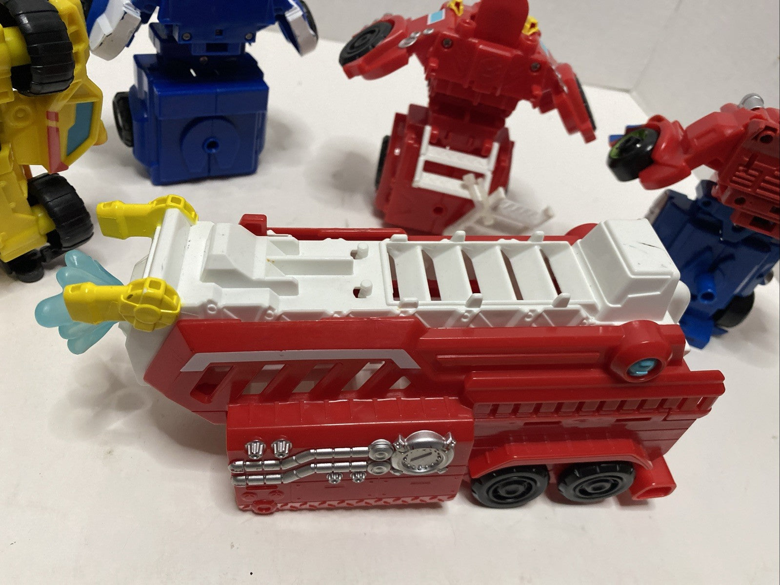Lot of 4 Hasbro Playskool Heroes Transformers Rescue Bots Figures Optimus Prime