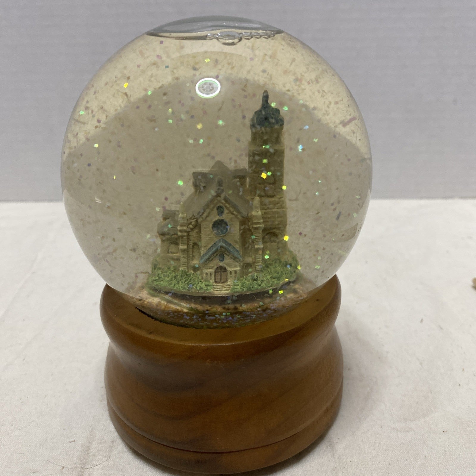Snow globe Church Plays “Oh Holy Night”