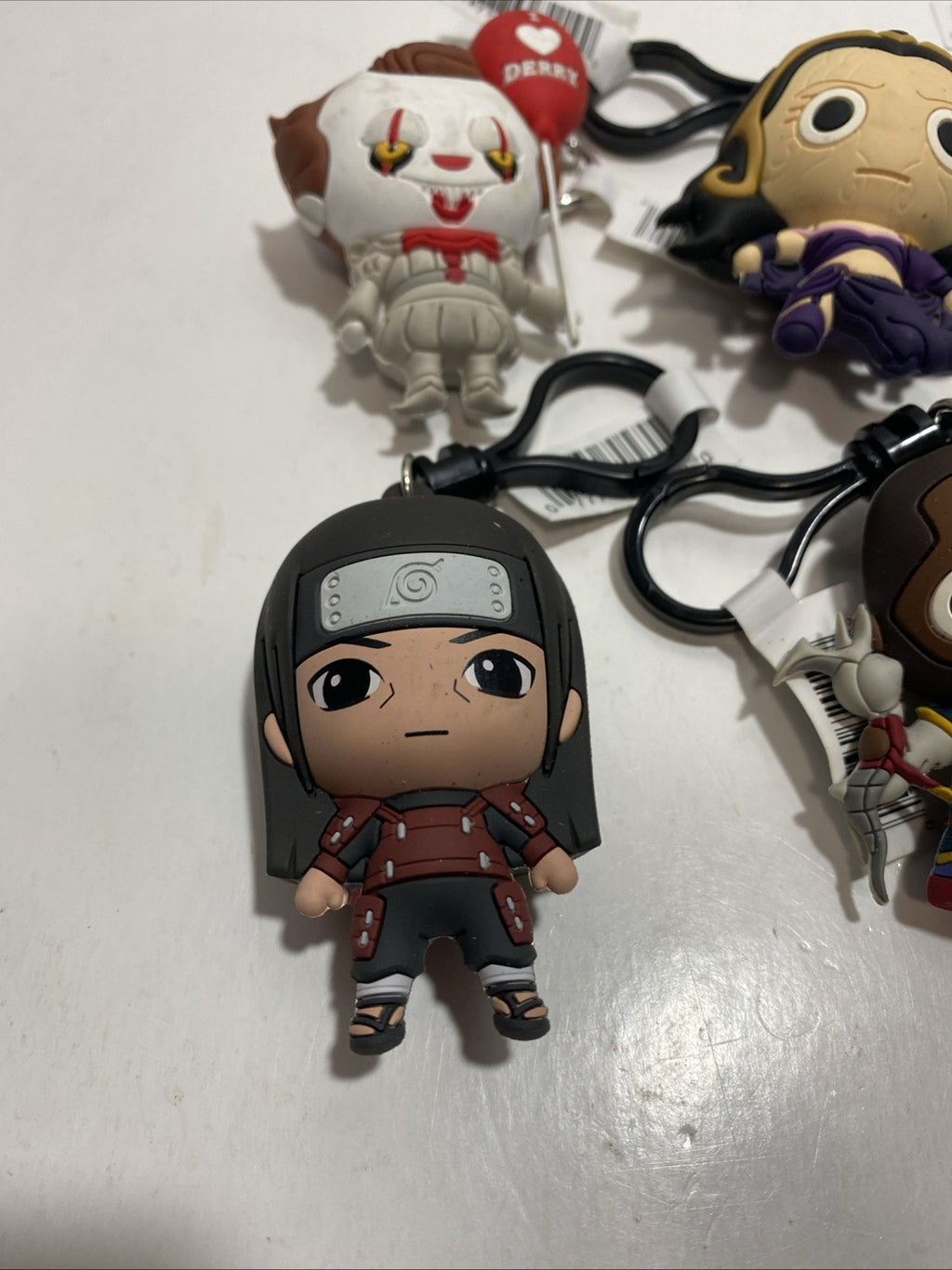 Lot of six keychain clips Pennywise, Darth Maul, please see pictures